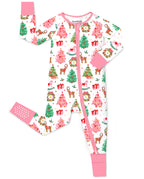 Blush Christmas zip-up romper with pink trim and sole-grip cuff, laid flat on white.