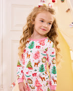 Close view of a child wearing the white Blush Christmas top with pink neckline.