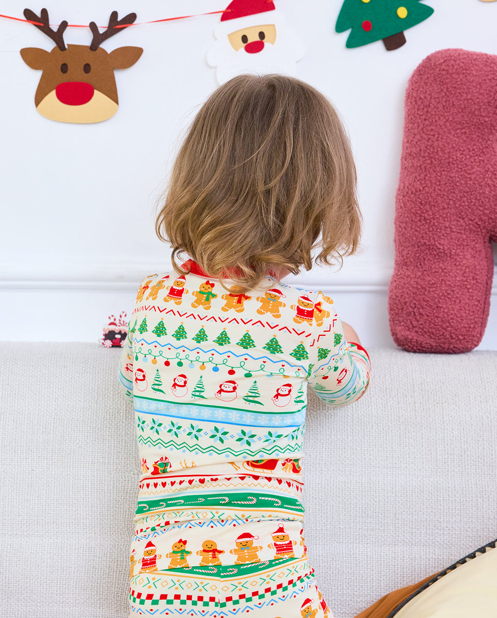 Rear close-up of Christmas Fair Isle pajama top with snowmen, trees, and geometric stripes