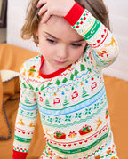 Close-up of Christmas Fair Isle red neckline and sleeve cuff as a child raises an arm