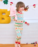 Child holding a pink toy while wearing Christmas Fair Isle long-sleeve pajamas