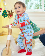 Child standing with a wooden ride-on toy in the Christmas Trains Bamboo Zippy beside festive tree and reindeer decorations.