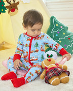 Child seated in the Christmas Trains Bamboo Zippy beside a gingerbread toy, with the red foot cuffs covering the feet.