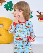 Close-up of a child wearing the Christmas Trains top with a red neckline.