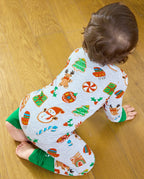 Overhead back view of a baby crawling in the grey Gingerbread Gala Bamboo Zippy with Christmas cookie motifs