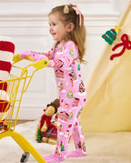 Child standing and holding a yellow cart handle in the Gingerbread Lane romper.