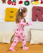 Side view of a child standing by a sofa in the Gingerbread Lane romper.