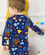 Rear close view of the Hanukkah Magic top with menorah, dreidel and star motifs.