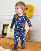Child standing in the navy Hanukkah Magic top and matching pants.