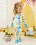 Child standing beside a small cart in the Happy Hanukkah zip-up romper.