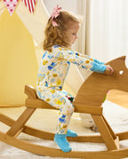 Rear view of a child holding a wooden rocking horse in the Happy Hanukkah romper.