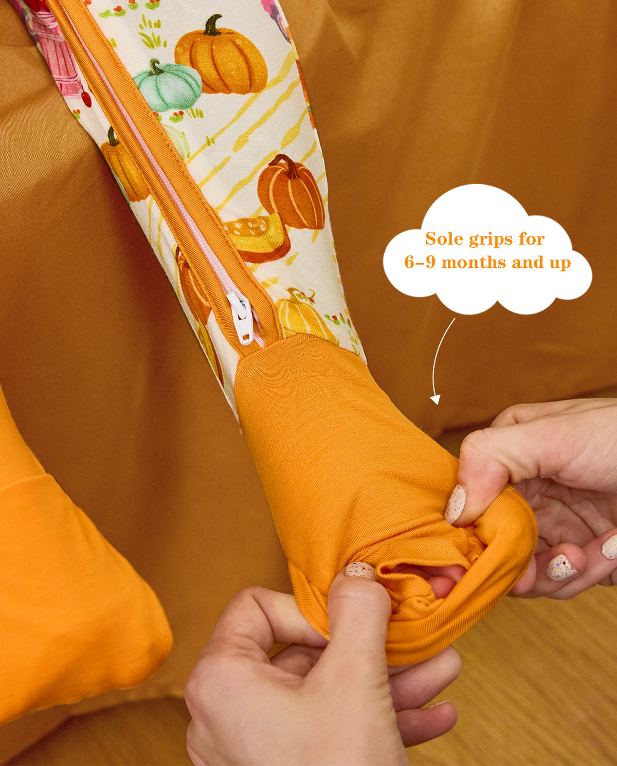 Close-up showing hands folding an orange foot cuff, with the original product annotation.