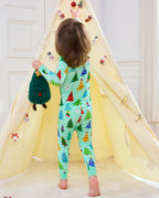 Rear view of Merry Trees long-sleeve pajamas beside a decorated holiday tent