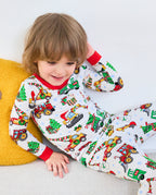 Close front view of Merry Truckmas pajamas showing festive construction vehicles