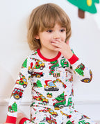 Close-up of Merry Truckmas top showing red collar, sleeve cuffs, trucks, and Christmas trees