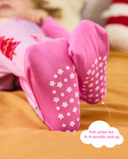 Close-up of pink foot cuffs with white star and dot sole grips, with the original annotation.