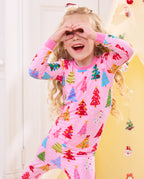 Child holding hands near the eyes while wearing the Pastel Christmas pajama set.