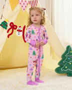Child standing by a play tent in the Pink Nutcracker romper with covered feet.