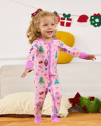 Child standing on a sofa with a hand extended in the Pink Nutcracker romper.