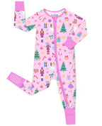 Pink Nutcracker zip-up romper with pink trim and visible sole grips, laid flat on white.