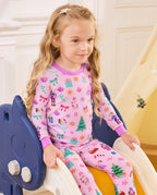Close view of a child seated on a slide in the Pink Nutcracker top.