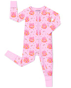 Pumpkin Bows zip-up romper with pink trim and a visible sole-grip cuff, laid flat on white.