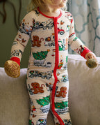 Close view of Santa Express zippy showing the red zipper and festive trucks as a child holds ornaments