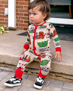 Child standing by outdoor steps in Santa Express zippy with red cuffs