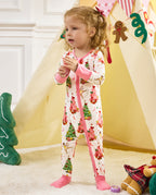 Child standing beside a tent in the Snuggle Sparkle zip-up romper.