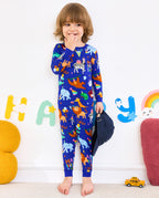 Child standing in blue Birthday Safari party-animal pajamas