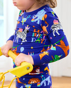 Close view of safari animals and Happy Birthday print on pajamas
