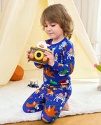 Child holding a toy camera in Birthday Safari pajamas