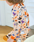 Boo Treats Long Two-Piece Pajama Set - child wearing the pajamas while walking, side view