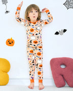 Boo Treats Long Two-Piece Pajama Set - child wearing the pajamas with both arms raised, front view