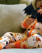 Close-up of Boo Treats Bamboo Zippy fabric with ghost pumpkin spider web and candy print