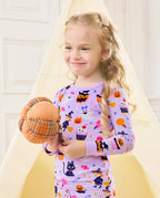 Candy Boo Long Two-Piece Pajama Set - child wearing the purple Halloween pajamas while holding a plush pumpkin