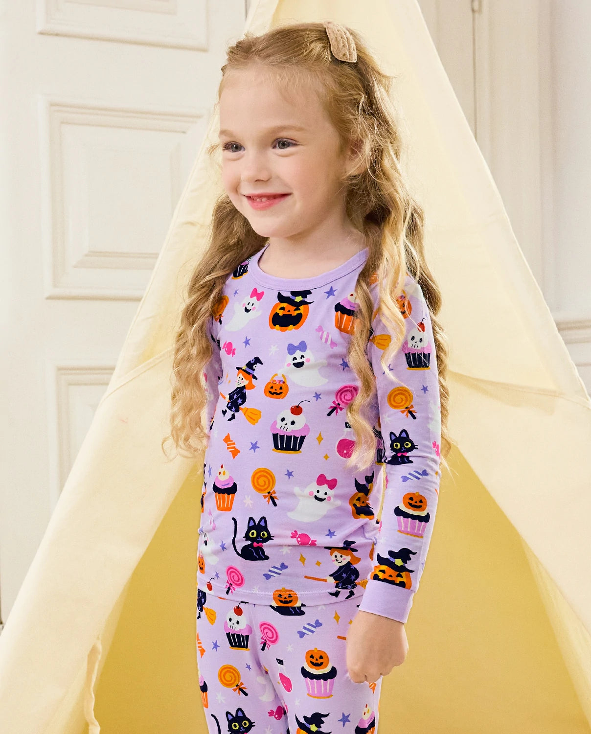 Candy Boo Long Two-Piece Pajama Set - child wearing the pajamas while standing, three-quarter view