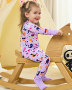 Candy Boo Bamboo Zippy child playing indoors with Halloween pajamas
