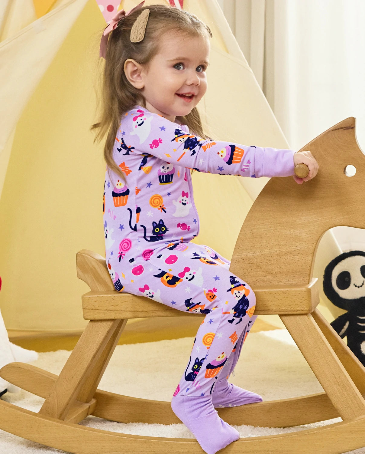 Candy Boo Bamboo Zippy child playing indoors with Halloween pajamas