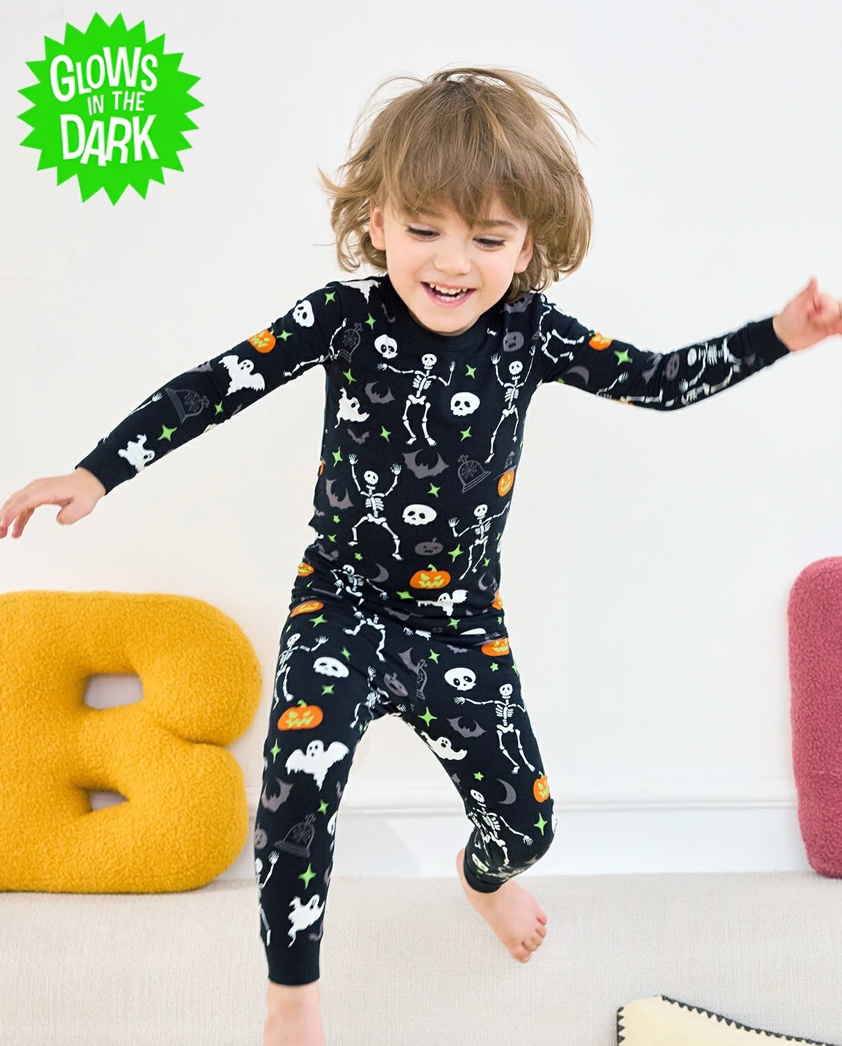 Dark Disco Long Two-Piece Pajama Set - child wearing the glow-print pajamas while jumping
