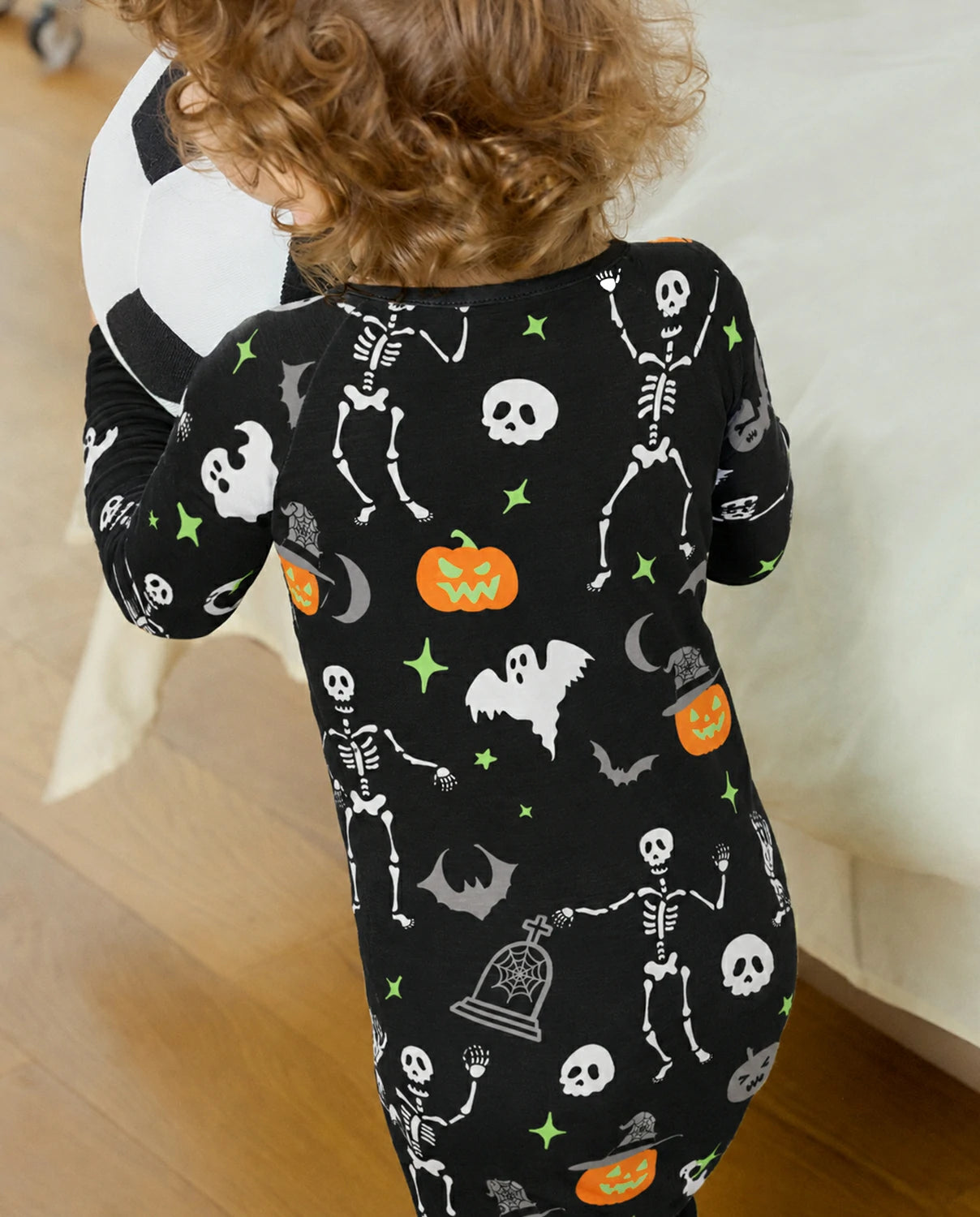 Close-up back view of Dark Disco Bamboo Zippy showing skeleton ghost pumpkin and bat print