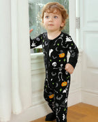 Child standing by a window in Dark Disco Bamboo Zippy with spooky Halloween print