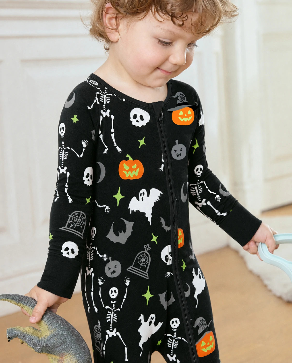 Close-up of Dark Disco Bamboo Zippy showing soft fabric and Halloween skeleton pumpkin print