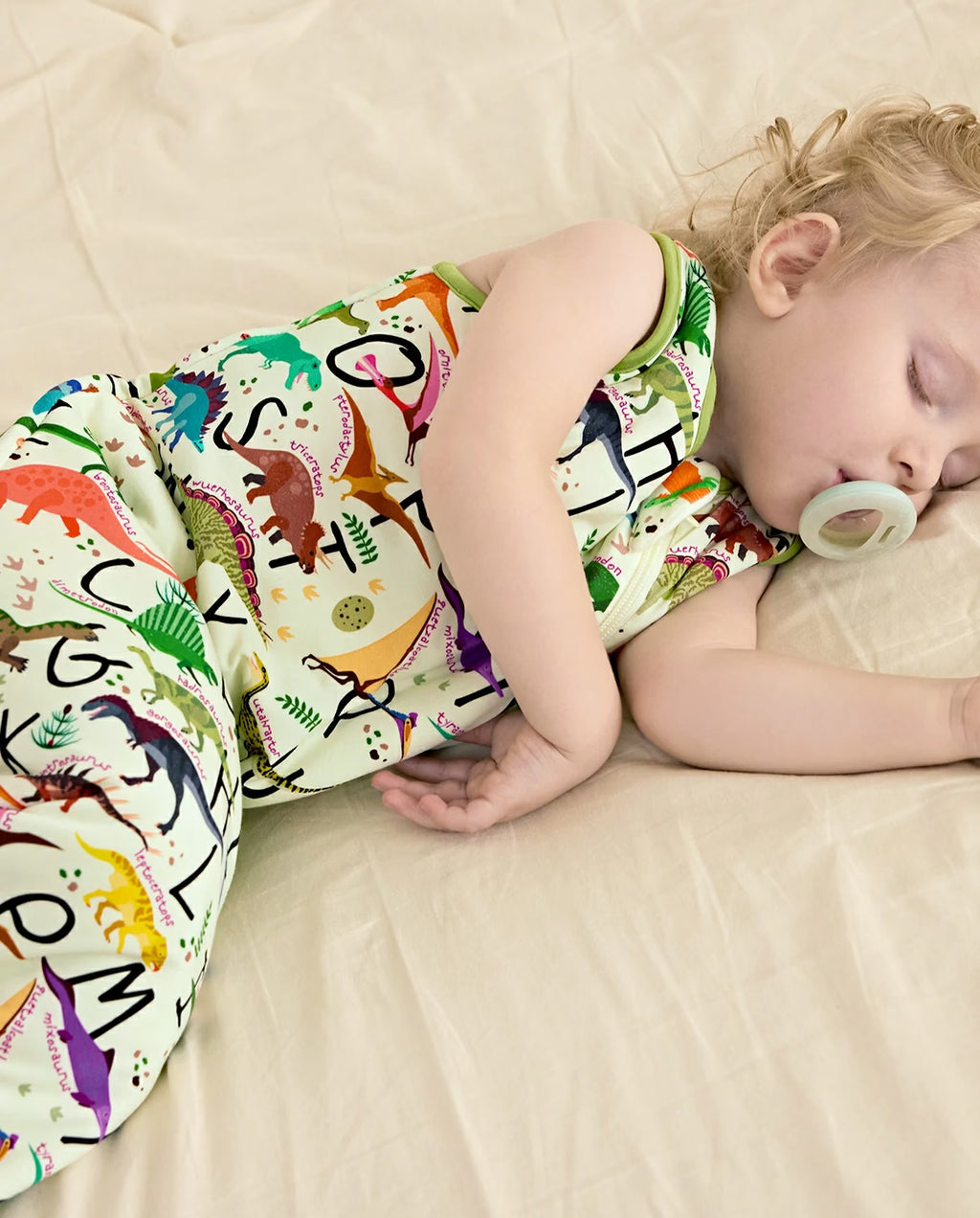 Dino Handbook Bamboo Baby Sleep Sack, dino dreams bamboo baby sleep sack side sleep 07