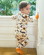 Baby standing in Happy Hallowboo Bamboo Zippy with back Halloween print visible
