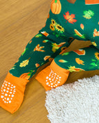Close-up of the orange foot cuffs and white grip dots on Harvest Feast Bamboo Zippy.