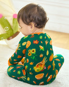 Back view of a baby in Harvest Feast Bamboo Zippy with harvest print and orange trim.