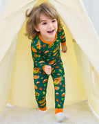 Child wearing Harvest Feast long two-piece pajamas inside a play tent.