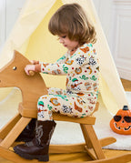 Howdy Halloween Long Two-Piece Pajama Set - child wearing the pajamas on a rocking horse, side view