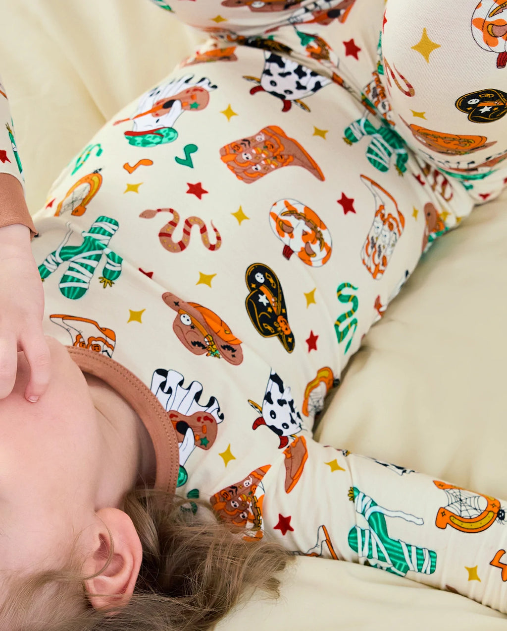 Howdy Halloween Long Two-Piece Pajama Set - close-up of the pajama print while lying down